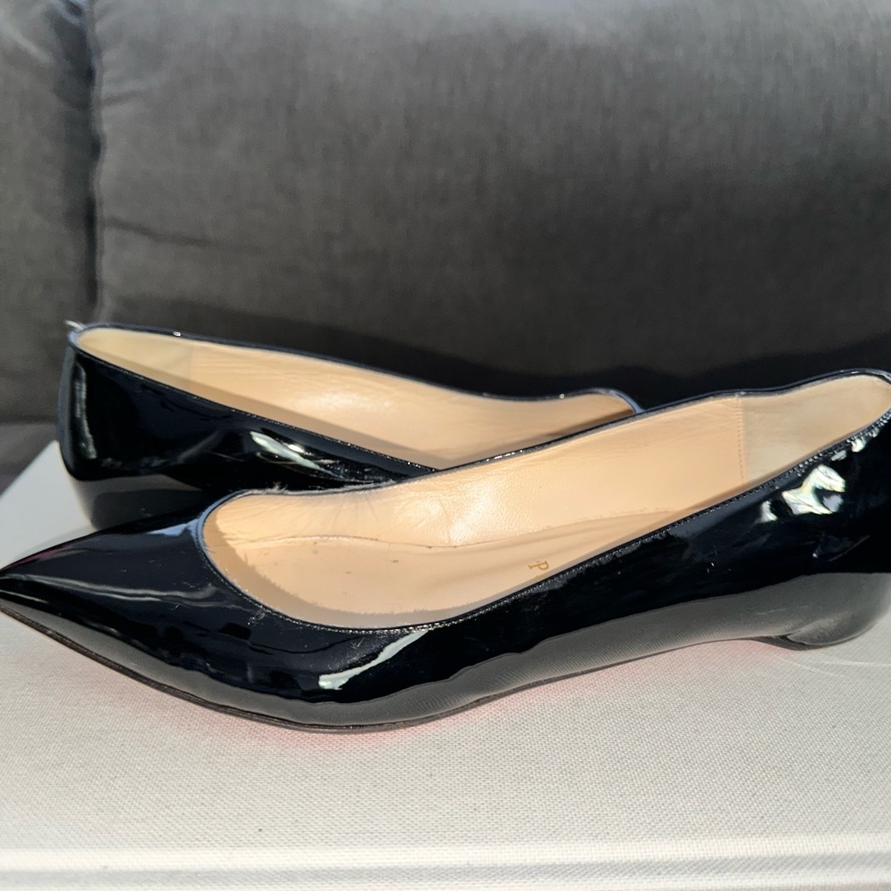 Point toe flat paten leather louboutin shoe used once. Dust bag included no box.